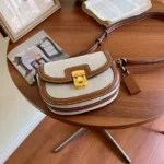 kf-Sbe2cf204b14744c48c5c25e3011e2861A-2024-New-Small-Style-Contrast-Panel-Canvas-Retro-One-Shoulder-Crossbody-Saddle-Bag-Handbags